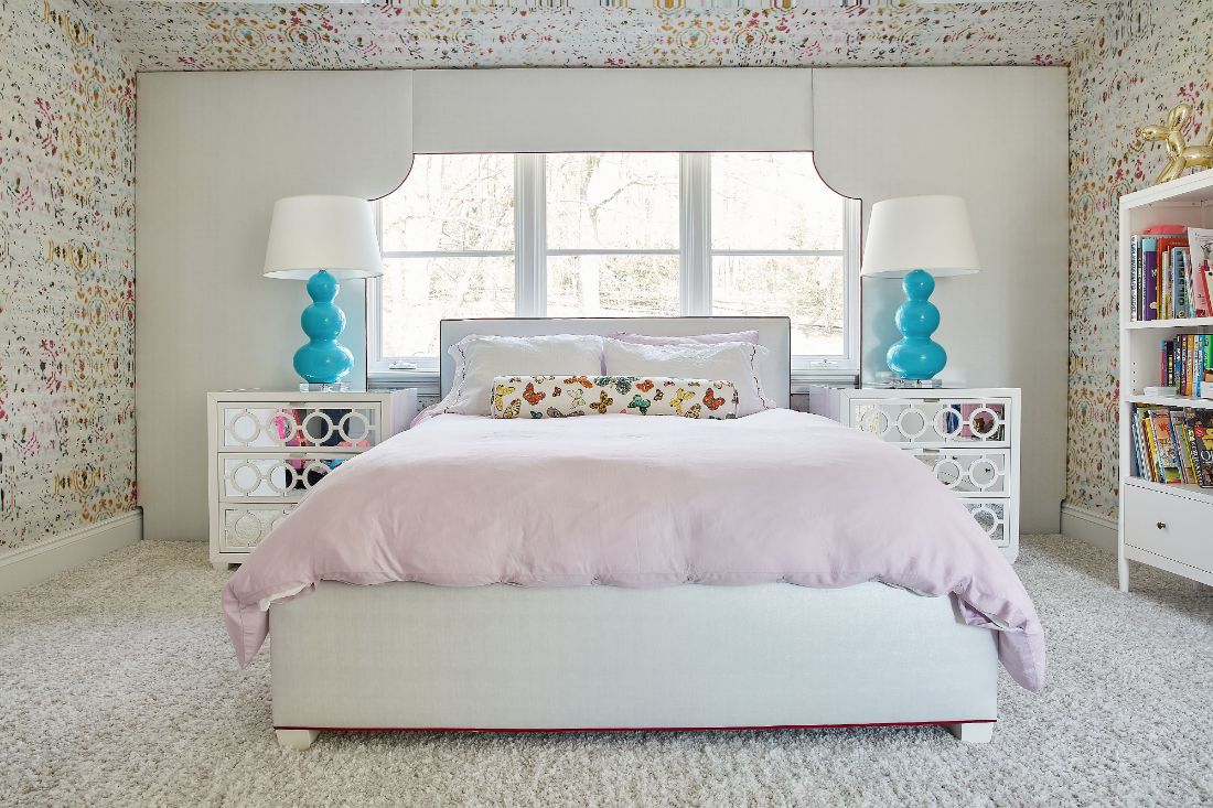 girls-bedroom-symmetry-blue-lamps-pink-comforter-2
